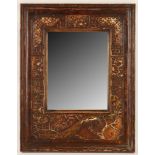 An early 19th Century English bevel edged mirror, in the Chinese style, press moulded gesso, overall