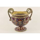 A 19th Century Italian majolica vase with twin snake handles, decorated in lustrous glazes in