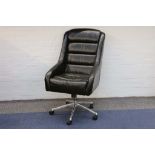 A MODERN BLACK LEATHER EXECUTIVE DESK CHAIR, manufactured by Andrew Martin, with swivel, tilt and