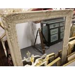 A cream painted pier glass with Laurel frieze over a framed insert with gadrooned border, together