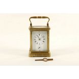 A brass and 5 glass alarm carriage clock with fully chased design to metal works. Height: 13cm