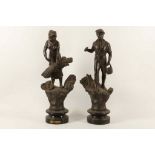 A pair of French Spelter figures depicting 'agriculture', supported on socle bases, 46.5cm high (