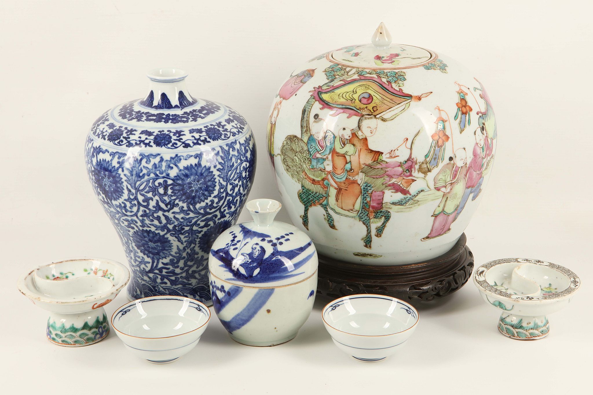 A group of Chinese and Japanese porcelain comprising a figurative ginger jar, a pair of 'sweet meat'