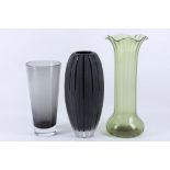 A WHITEFRIARS SMOKED GLASS VASE, circa 1960, together with an early 20th Century green glass vase,