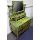 A green painted dressing table with mirror over drawers all decorated in a classical manner.