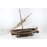 A mid 20th Century scratch built sail boat with painted finish. 76.5cm long