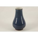 A Chinese 19th / 20th Century monochrome sky blue mallet shape vase, bearing double blue circle to