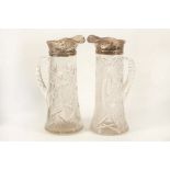 A good pair of cut glass claret jugs, with Sterling silver hallmarked mounts, marked 925, 26cm
