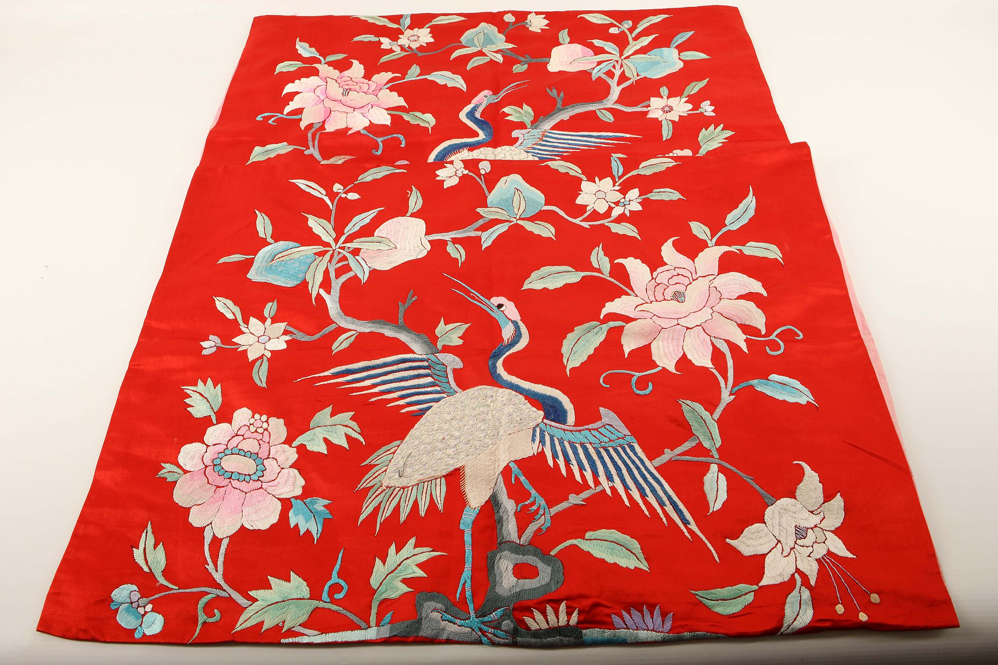 A pair of Chinese embroidered 'bird and flowers' silk pillow cases, 42 x 56cm.