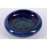 WILLIAM MOORCROFT 'MOONLIT BLUE' DISH, CIRCA 1925, with inverted rim, impressed marks under, (10.7cm