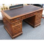 An early 20th Century mahogany pedestal desk with inset black leather top.