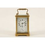 A brass and 5 glass alarm carriage clock. Height: 11.5cm