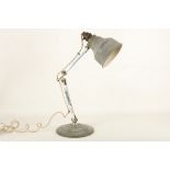 A 1930s INDUSTRIAL TABLE LAMP, with steel shade and base, joined by chrome stem, (52cm high)