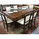 An Art Deco walnut dining table and six chairs