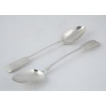 Two Antique Sterling Silver basting spoons in fiddle pattern One George IV provincial West Country