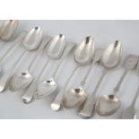 A selection of Antique Georgian and later Sterling Silver serving spoons in Fiddle and Old English