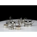 A mixed lot of Antique Sterling Silver items to include three mustard pots, a toast rack, three