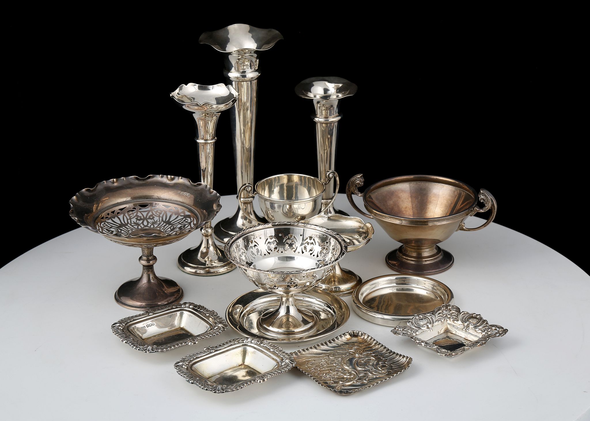 A mixed lot of Antique Sterling Silver items to include small tazzas, pin dishes, fluted spill