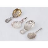 Four Sterling Silver tea caddy spoons One with high relief foliate decoration to the bowl, with a