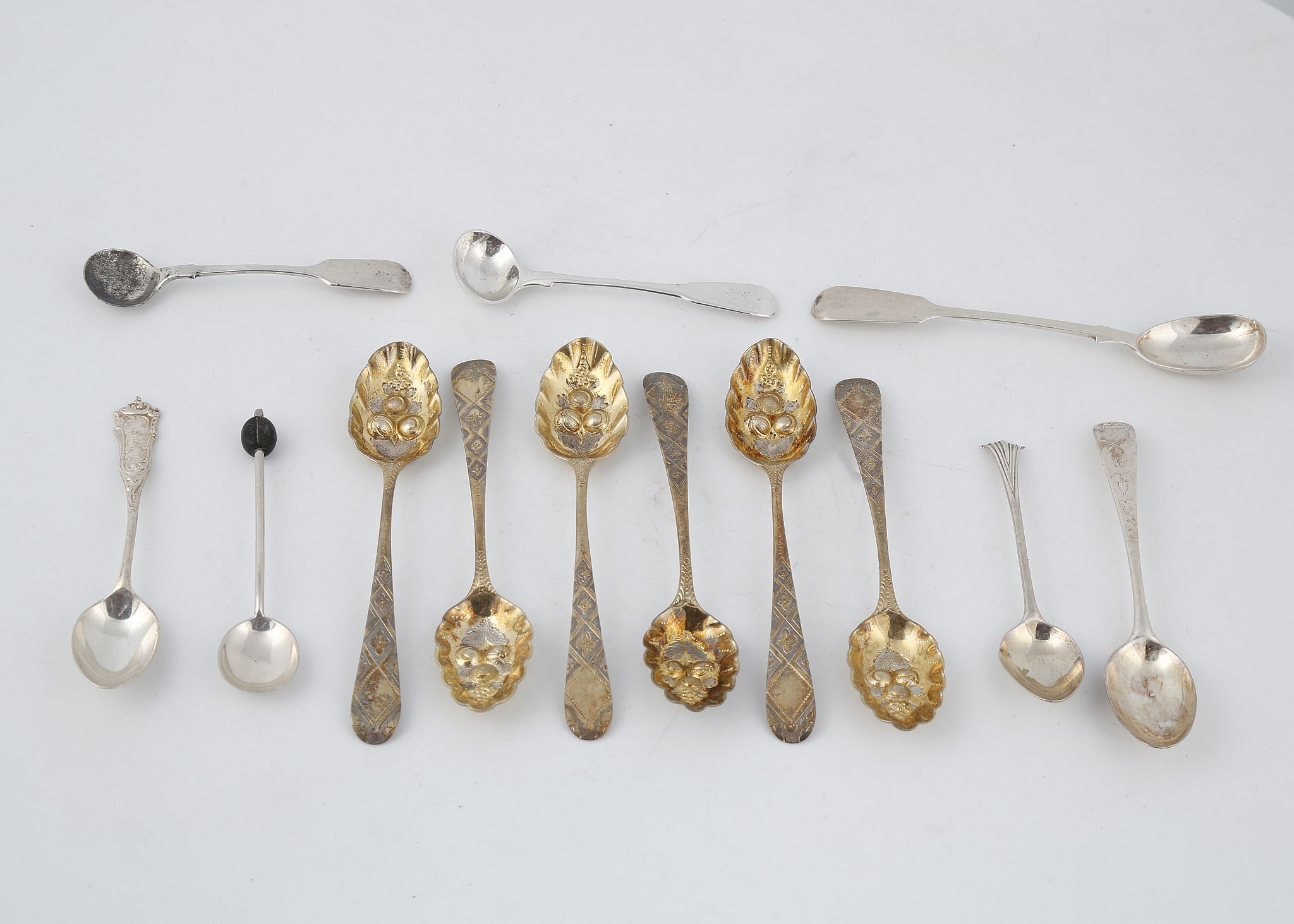 A mixed lot of Antique Sterling Silver spoons to include a set of six Georgian silver gilt berry