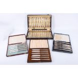 A cased set of 12 silver handled King's pattern dessert knives and forks, with 3 further cased