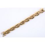 A vintage 18ct gold faceted brick link bracelet. Length: 18cm. Weight: 72g.