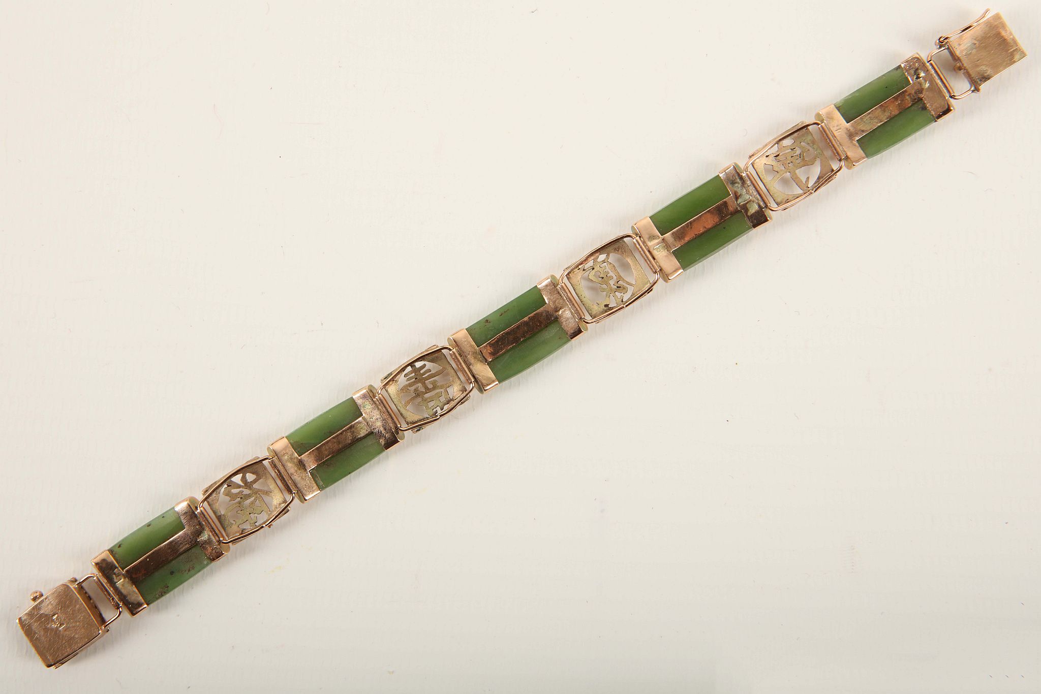 A vintage Chinese jade and gold bracelet c.1950, the curved two two nephrite bars with yellow gold - Image 2 of 2