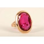 A 19th Century Austro-Hungarian 14ct gold and simulated ruby dress ring with large collet set oval