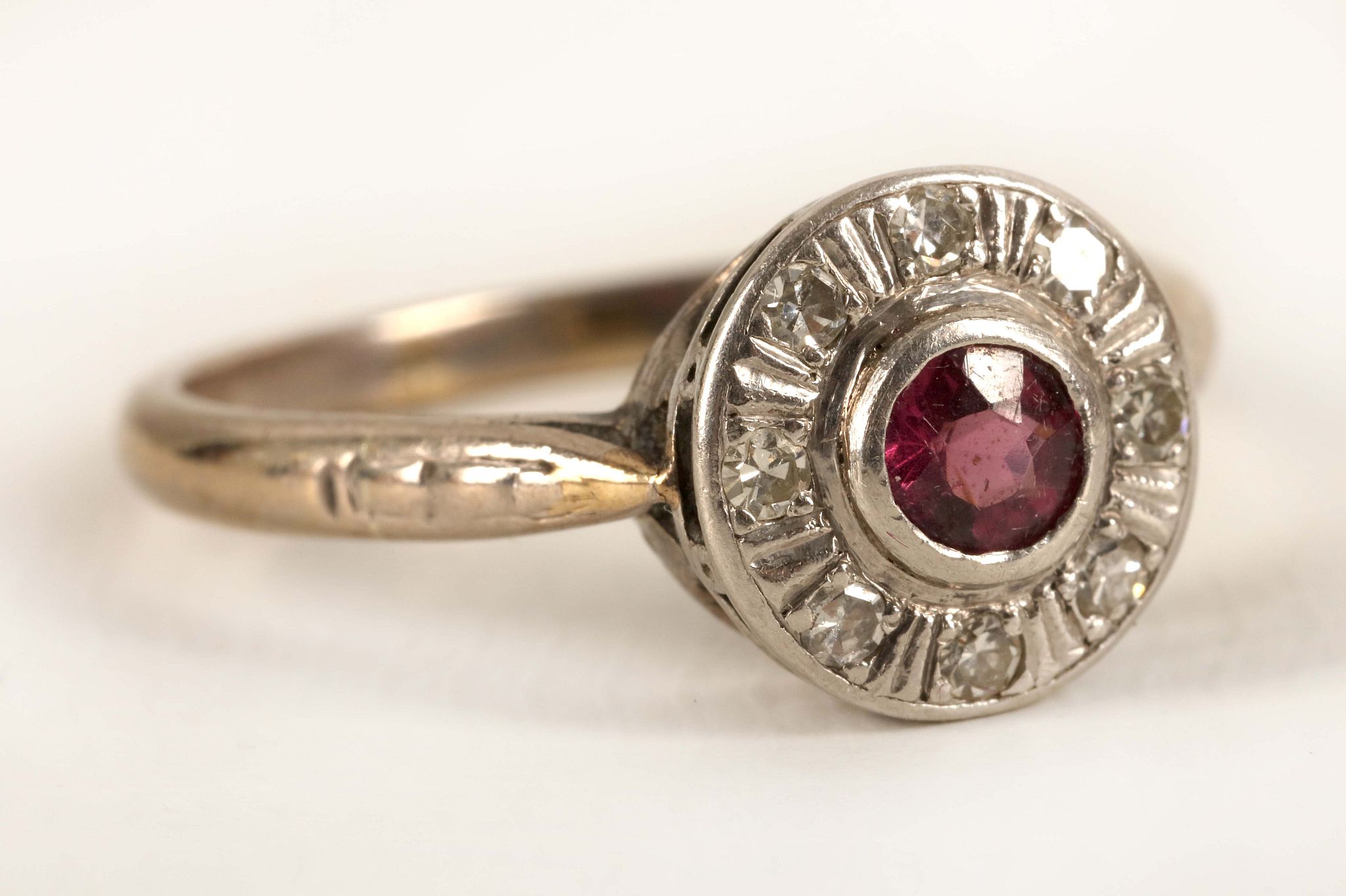 An 18ct gold, ruby and diamond cluster ring.