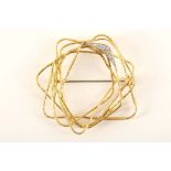 A c.1960's 18ct gold and diamond set wire nest brooch by 'Haller Jewellery Company' for 'Grima'.