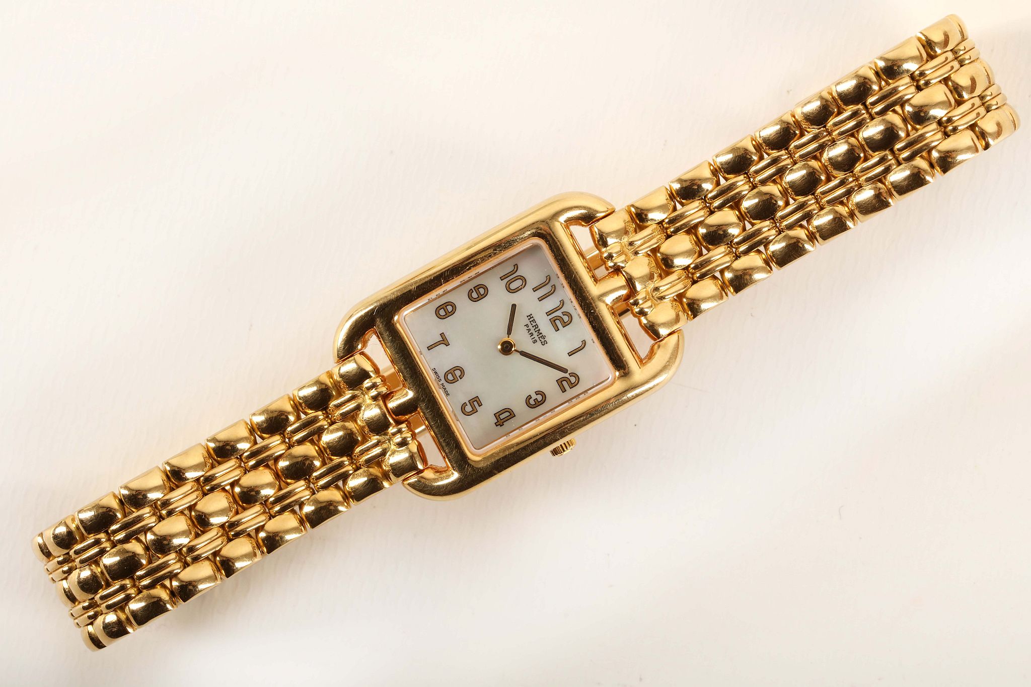 A ladies 18ct gold 'Hermes - Cape Cod' bracelet watch, with mother of pearl dial and concealed - Image 2 of 4