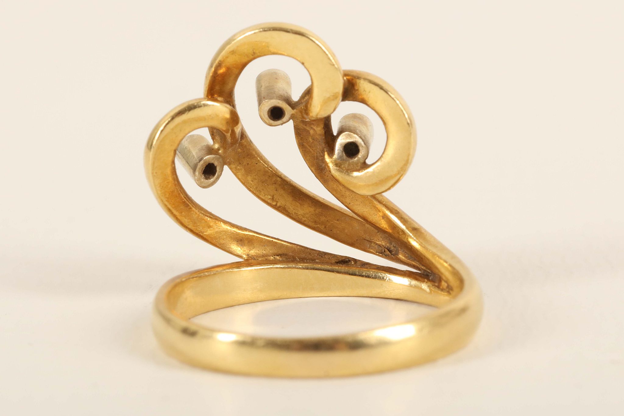 An 18ct gold and diamond set wave scoll dress ring. Size: N. 6.36g, - Image 2 of 2