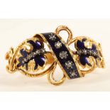 An antique yellow gold, enamel and rose-cut diamond bangle c.1870. Designed as two yellow gold and