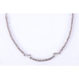 A 14ct white gold and diamond set necklace, the 53 graduated brilliant round cut stones interspersed