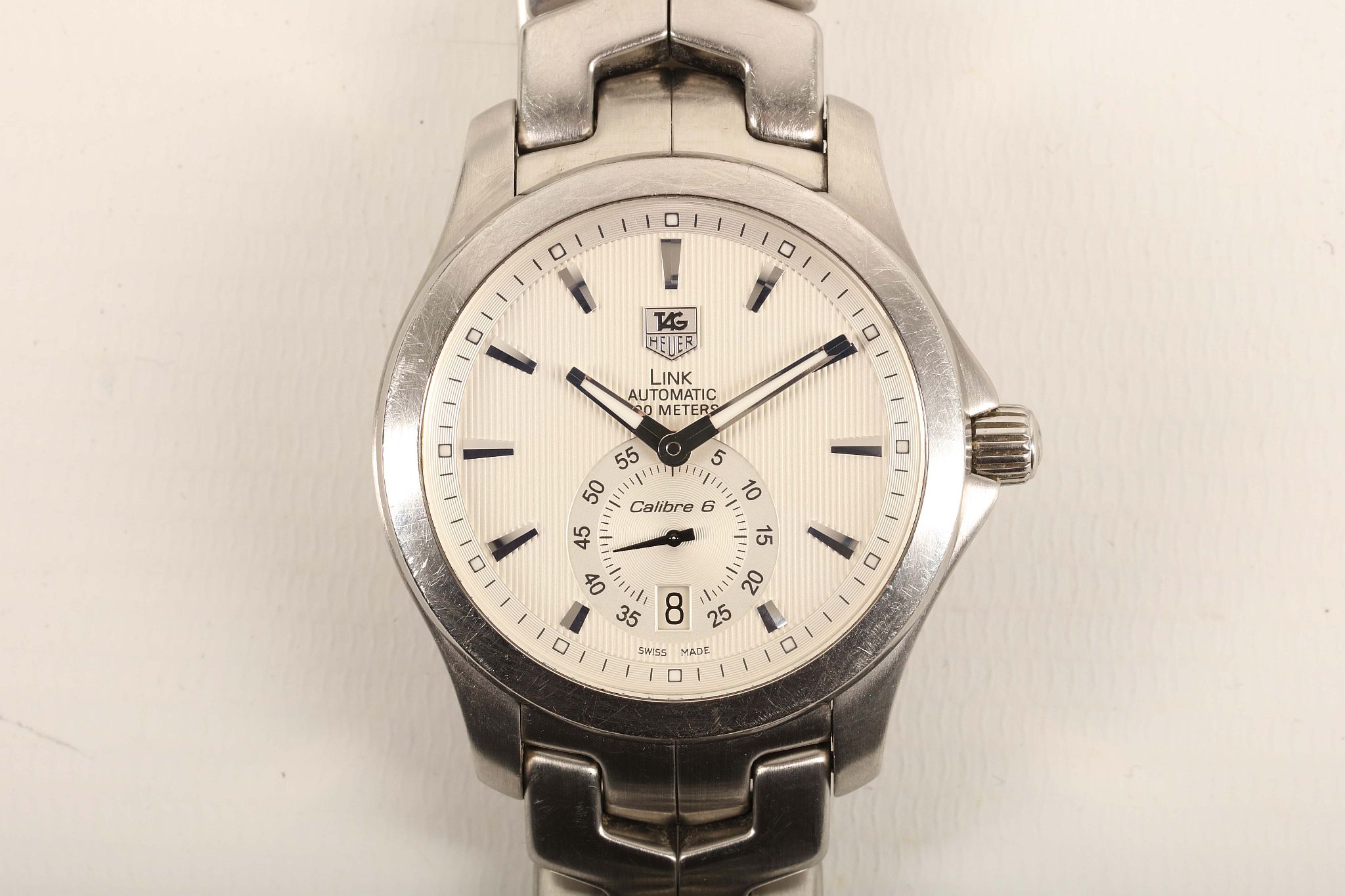 A gent's c.2009 stainless steel cased 'Tag Heuer - Link' calibre 6 automatic wristwatch, with