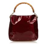 GUCCI RED PATENT LEATHER BAMBOO HANDBAG, with round bamboo handle and detachable shoulder strap,