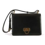 SALVATORE FERRAGAMO NAVY LEATHER HANDBAG, 1990s, with adjustable top strap and gilt metal clasp,