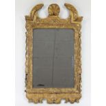 A George II style carved and gilded wall mirror with shell cresting, 87.