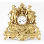 A French gilt spelter mantel clock, the enamel dial with Roman numerals, striking on a bell,