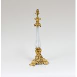 A gilt metal and opaque glass table lamp, the central ribbed white opaque glass stem supported