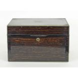 A coromandel dressing case, brass bound and with fitted interior (no contents),