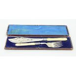 A pair of fish servers with crested ivory handles, in a folding case, a silver plated square waiter,