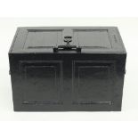 An iron strong box, with hinged cover and carry handles to the sides,