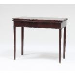 A George III mahogany serpentine card table with concertina action,