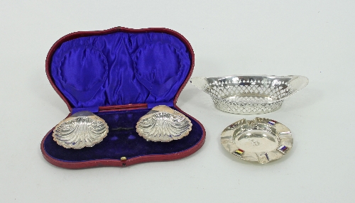 A silver boat-shaped basket, H A, Sheffield 1898, a pair of shell-shaped butter dishes, London