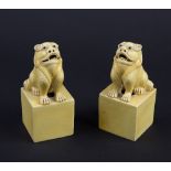 A pair of Chinese yellow glazed lion dogs,