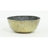 A Chinese circular brass bowl engraved a band of stylised designs within a Greek key border,