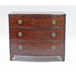 A Hepplewhite period mahogany chest of three long drawers, the top cross-banded, raised on splay