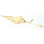 A Japanese parasol, circa 1900, the ivory handle carved a monkey and vines,