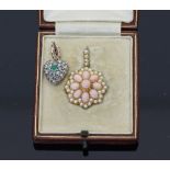 A coral and seed pearl pendant/brooch, the central coral cluster to a border of seed pearls in a